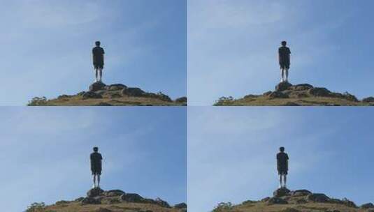 男子立于山顶眺望远方高清在线视频素材下载