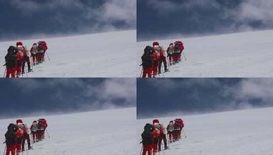 风雪中攀登慕士塔格雪山的登山者高清在线视频素材下载