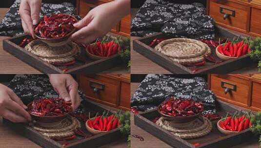 双手在桌上端起装在碗里的红色干辣椒调料高清在线视频素材下载