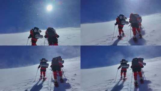风雪中攀登慕士塔格雪山的登山者高清在线视频素材下载