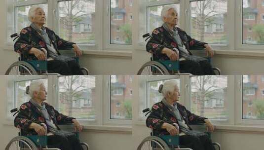 坐轮椅老人窗边凝望高清在线视频素材下载
