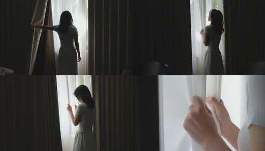 女人拉开窗帘看见第一缕阳光高清在线视频素材下载