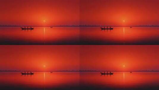 落日余晖下静谧的湖面渔船剪影高清在线视频素材下载