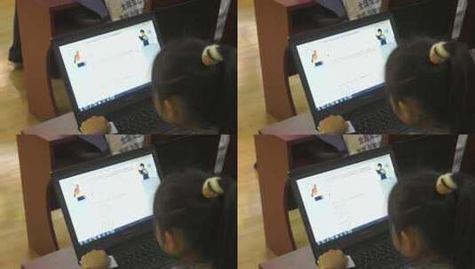 小女孩使用笔记本电脑学习高清在线视频素材下载