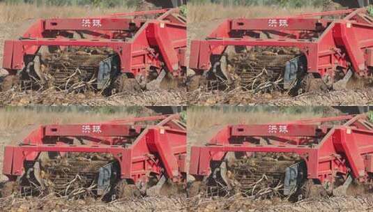 农田红色收割机作业画面高清在线视频素材下载