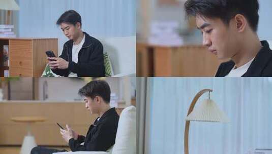 男子居家看手机场景高清在线视频素材下载