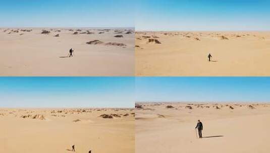 沙漠徒步旅行者远景画面高清在线视频素材下载