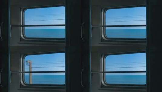 火车车厢内透过窗户看海洋高清在线视频素材下载