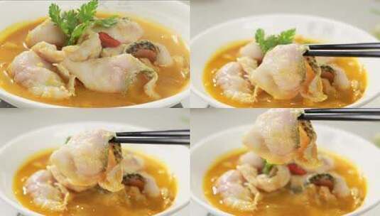 盛在碗中的黄汤鱼片高清在线视频素材下载