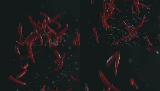 红辣椒飞起落下溅起水花升格棚拍高清在线视频素材下载
