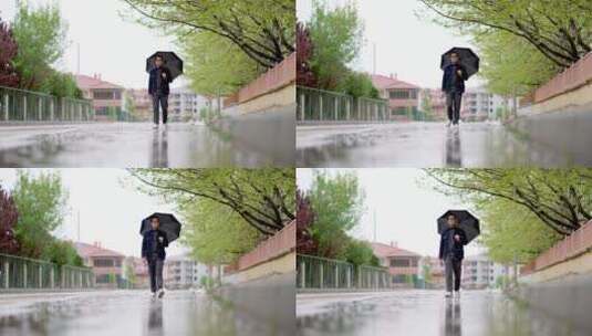 男人下雨天撑伞走在街上高清在线视频素材下载