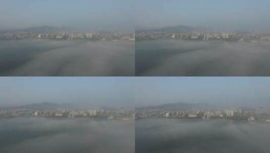 威海湾幸福门上空的平流雾航拍4K高清在线视频素材下载