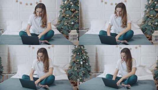 女人在布满圣诞装饰的房间发邮件高清在线视频素材下载