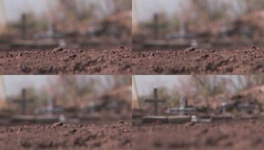 聚焦拍摄坟墓上的十字架高清在线视频素材下载