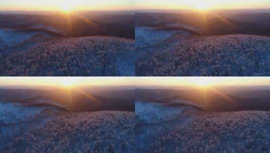 航拍夕阳照耀下的大兴安岭雪色山林高清在线视频素材下载