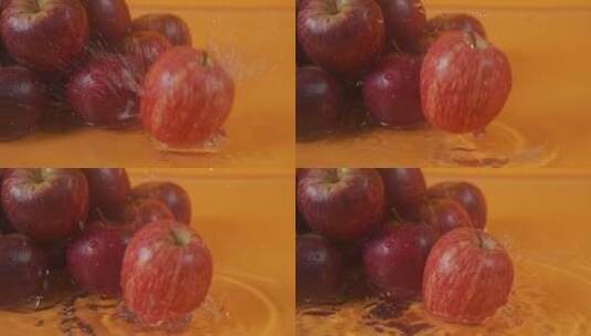 红苹果旋转落下溅水高清在线视频素材下载