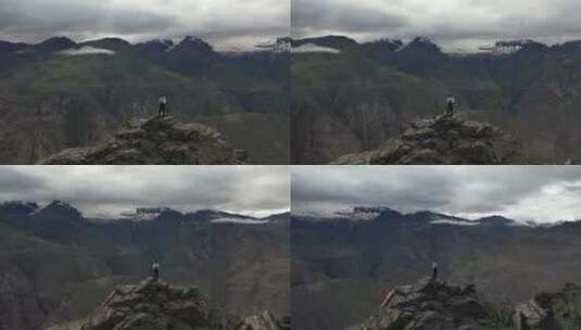 西藏山南市拉康镇一个人站在悬崖高处高清在线视频素材下载