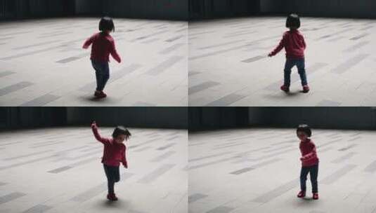 小女孩在广场上跳舞高清在线视频素材下载