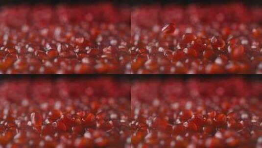 新鲜红石榴籽落在石榴籽堆里镜头高清在线视频素材下载