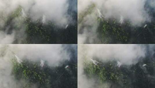 4k航拍森林场景中的电力塔顶视图云海缭绕高清在线视频素材下载