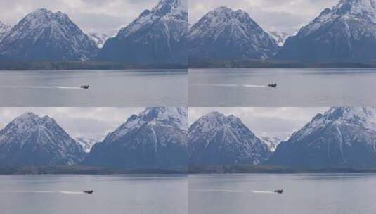 被山脉环绕的船和湖高清在线视频素材下载