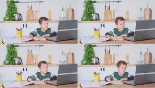 男孩正在看电脑高清在线视频素材下载