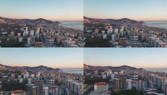城市上空多彩的日落鸟瞰4 K阿拉尼亚土耳其高清在线视频素材下载