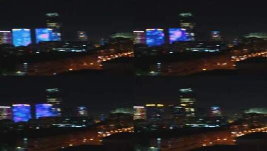 夜晚国贸CBD灯光秀模糊镜头 竖屏 4K高清在线视频素材下载