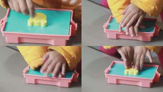 盖上盖板用双手压盖板的儿童 幼儿手工高清在线视频素材下载