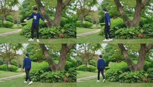 男子在公园张开双臂放松高清在线视频素材下载