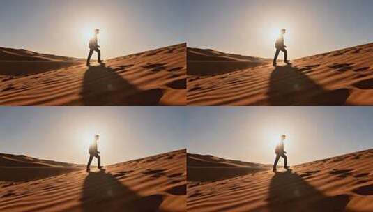 男子在沙漠中行走高清在线视频素材下载