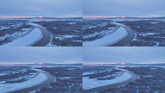 航拍晨曦中的雪原河流景观高清在线视频素材下载