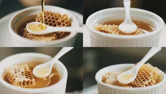 蜂蜜倒入盛有蜂巢蜜的白碗高清在线视频素材下载