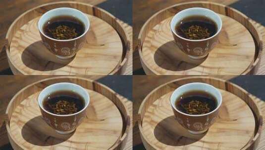木盘上的一杯茶饮高清在线视频素材下载
