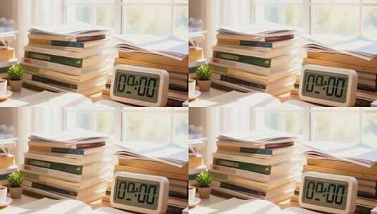 书桌上的书籍与电子闹钟高清在线视频素材下载