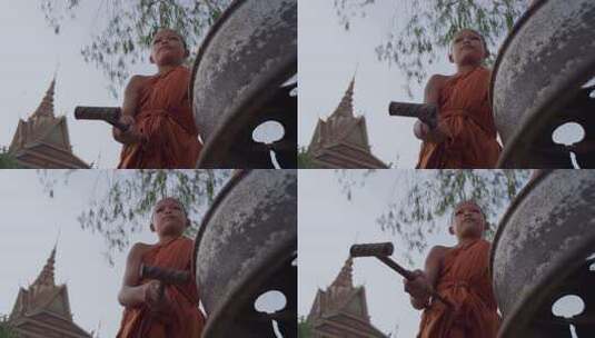 柬埔寨农村寺庙的小和尚在敲钟高清在线视频素材下载