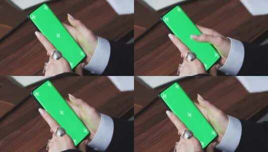 女性使用绿色背景智能手机在手机上滚动手部高清在线视频素材下载