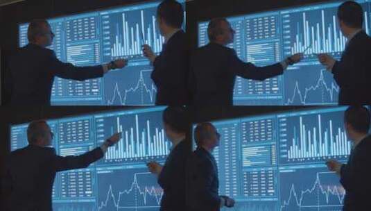 分析大屏幕图表的金融数据分析师高清在线视频素材下载