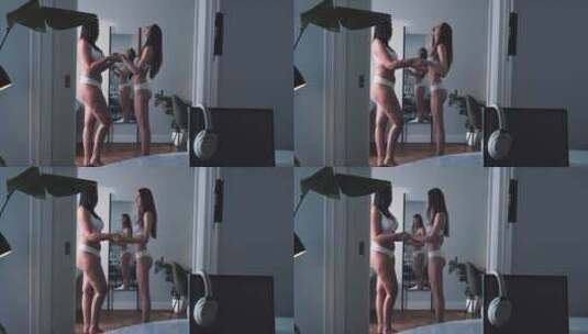 两个女孩在镜子前跳舞高清在线视频素材下载