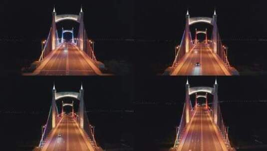 航拍夜景大桥穿越桥面七彩绚丽灯光汽车过桥高清在线视频素材下载