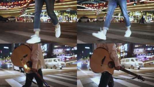 男子手拿吉他行走街头高清在线视频素材下载