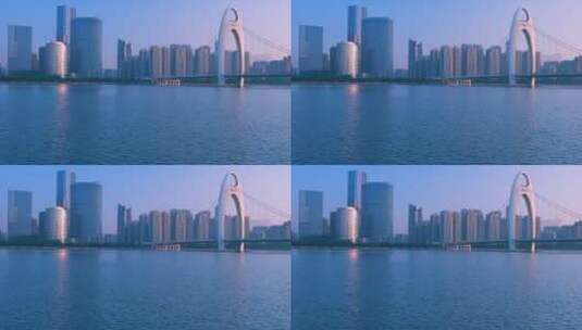 晨光照耀在珠江猎德大桥和摩天大楼建筑上高清在线视频素材下载