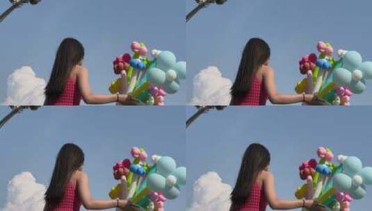 女孩手持彩色气球打卡济南宽厚里、泉城广场高清在线视频素材下载