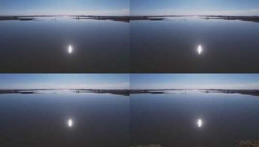午后清澈湖水中移动的太阳高清在线视频素材下载