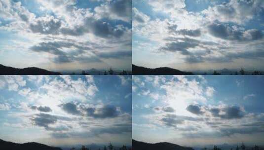天空延时阳光穿过云朵上帝之光丁达尔耶稣光高清在线视频素材下载