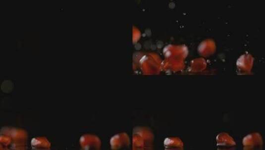 新鲜红石榴籽落在台面上溅起水花高清在线视频素材下载