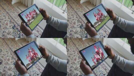 男人在平板电脑上观看体育赛事高清在线视频素材下载