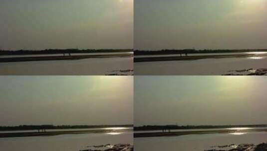 夕阳下黄河边捕鱼高清在线视频素材下载