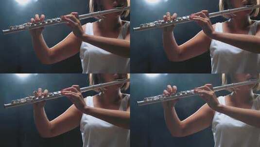 女音乐家长笛演奏。烟雾工作室高清在线视频素材下载