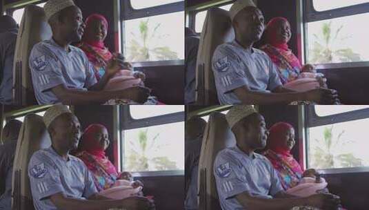 非洲火车上车厢内一家三口温馨相伴高清在线视频素材下载